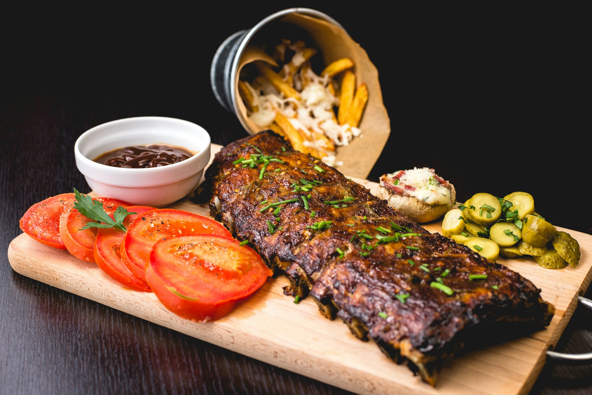 Charcoal-grilled meat with herbs and rustic accompaniments